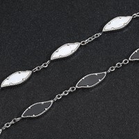 Bracelet de coquillage noir et blanc en acier inoxydable au design de luxe pour hommes et femmes, accessoires de bijoux en couches, vente en gros