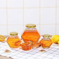 Vente en gros directe d'usine, pot à miel en verre hermétique, verre transparent de qualité alimentaire, couvercle à vis en métal, pot réutilisable pour le stockage du miel