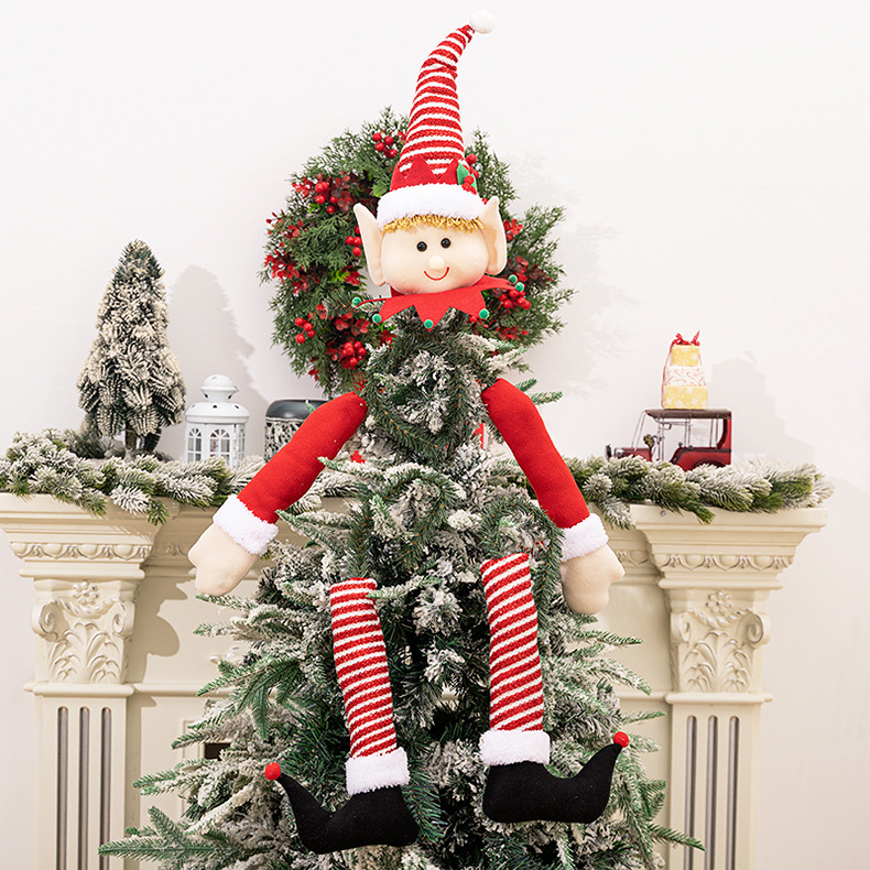 Christmas tree hugging doll elf