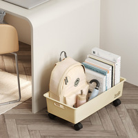 Organisateur de livres et de sacs à dos moderne sous table, solution de rangement mobile à roulettes pour dortoirs d'étudiants et salons