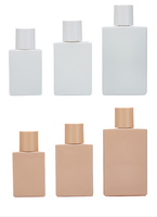 Vente en gros d'usine de flacons de parfum mats noirs, blancs et roses. Flacons de parfum plats. Bouteilles en verre avec pompe pulvérisatrice et bouchon