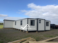 Nouvelles maisons préfabriquées en conteneurs de style moderne, résistantes aux tremblements de terre et au vent, alimentées à l'énergie solaire, de la marque HS, à prix abordable, garantie 1 an pour bureau