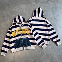 Sudadera con capucha y cremallera a rayas con logo personalizado para hombre, estilo oversize, bordado de chenilla, con tachuelas, estilo streetwear, fabricante mayorista