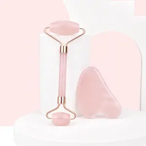 Hanhe Vente en gros Outil de massage facial Rouleau de jade rose et ensemble de Gua Sha avec boîte Logo personnalisé Rouleau Gua Sha en quartz rose de génie