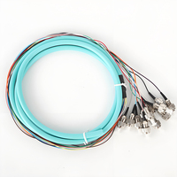 12-Core FC UPC OM3 Bundel Fiber Optik Pigtail 1.5 Meter Aqua FTTH 50/125 MM Multi Mode 10Gbps 0.9mm untuk Panel Patch Fiber