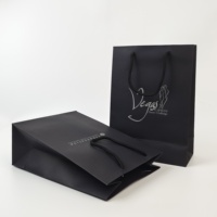 Sacs shopping en papier personnalisés avec logo, sacs cadeaux noirs de luxe avec poignées pour l'emballage de vêtements de boutique