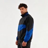 Veste de sport tissée classique pour homme, noire et bleue, avec blocs de couleur, idéale pour l'entraînement en extérieur, le fitness et les activités quotidiennes décontractées