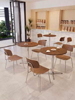 Ensemble de salle à manger bistrot moderne et simple, table ronde avec base en métal, chaises en contreplaqué pour restaurant, café, pâtisserie