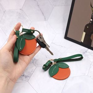 Porte-clés décoratif en cuir PU RTS, pendentif mignon orange pour sac, breloque en métal, support portable pour clés de voiture, cadeaux d'affaires - Product Image 4