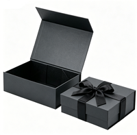 Boîte cadeau magnétique noire mate avec fermeture sécurisée, inserts personnalisés et impression disponible pour divers produits