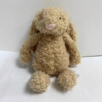 Peluche lapin beige à poils bouclés style vintage, oreilles tombantes et duveteuses