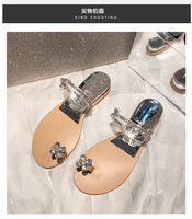 Sandales plates pour femmes à fleurs en strass, claquettes à bride transparente en PVC, chaussons d'été à anneau de pied en cristal, support OEM ODM