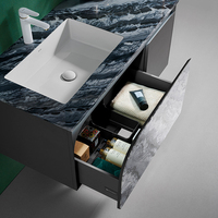 Meuble-lavabo suspendu minimaliste en acier inoxydable pour salle de bain avec miroir éclairé irrégulier