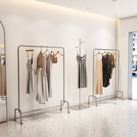 Présentoirs suspendus pour magasin de vêtements ronds en acier inoxydable, haute qualité, prix de gros, 2023