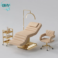 Lit de massage cosmétique électrique pour cils Table de massage spa de luxe Lit pour salon de beauté Mobilier d'esthéticienne Base dorée Lit incurvé pour le visage