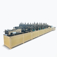 Machine automatique de découpe et de perforation pour la fabrication de protège-coins en carton