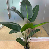 Plante artificielle Strelitzia hautement réaliste en pot, feuillage vert pour la décoration intérieure et l'aménagement paysager