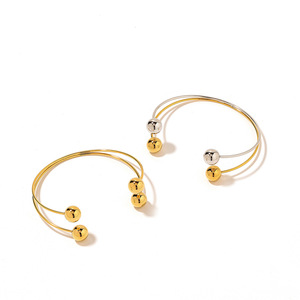 Yunnique Brazalete personalizado de acero de titanio con doble bola, chapado en oro de 18 quilates, estilo europeo, regalo de joyería de moda para mujer - Product Image 4