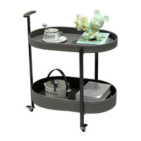 Table d'appoint mobile double couche moderne et légère et luxueuse Table basse ovale avec roulettes Support de rangement simple Design métallique
