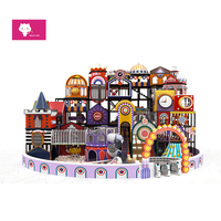 Structure de jeu intérieure souple avec pont d'escalade, couleurs arc-en-ciel, style Morandi, équipement de jeu pour enfants