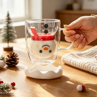 Tasse en verre à double paroi Père Noël avec poignée transparente, couvercle en forme de boule de neige et motif flocon de neige