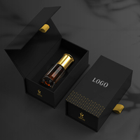 Emballage en papier de parfum noir de luxe personnalisé boîte cadeau en carton à fermeture magnétique de style livre pour bouteille en verre