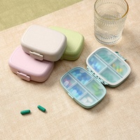 Boîte à pilules portable en plastique à 9 compartiments, étanche à l'humidité, avec impression de logo disponible