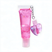 Best-seller transfrontalier : Brillant à lèvres effet miroir changeant de couleur, hydratant et repulpant, avec ornement suspendu en forme de coquille et de cœur