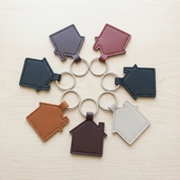 Porte-clés en forme de maison en cuir PU, portable, multifonctionnel, décoratif, breloque promotionnelle pour sac, cadeau pour agents immobiliers