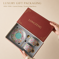 Boîte cadeau de luxe haut de gamme en forme de livre avec couvercle en feuille d'or, revêtement UV, insert en mousse et personnalisation OEM