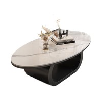 Table basse de forme irrégulière en dalle de pierre ovale, design moderne et minimaliste, idéale pour les petits espaces de vie et l'usage domestique.