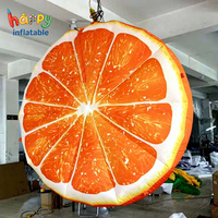 Modèle de tranche d'orange géante gonflable, ballon publicitaire personnalisé en forme de fruit des agrumes pour la promotion de bars à jus et les événements.