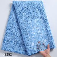 2252 Vente en gros de tissus en dentelle à sequins de lait nigérians bleu ciel, dentelle filet brodée africaine, offre spéciale
