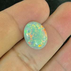 โอปอลธรรมชาติจากเอธิโอเปีย - โอปอลไฟสุดตระการตา หลากหลายแบบ โอปอลหลวมแบบคาโบชอง ราคาขายส่งจากโรงงานสำหรับทำเครื่องประดับ - Product Image 1