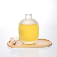 Bouteilles de jus en verre givré, forme ronde, avec bouchon en bois pour l'emballage de jus et de boissons