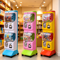 Distributeur automatique de capsules à deux niveaux pour centres de jeux, fonctionnant à monnayeur