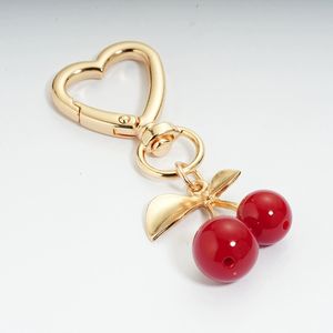 Pendentif cerise feuille d'or Uionen avec pièces en alliage, porte-clés DIY en forme de cerise avec breloque en forme de cœur - Product Image 1