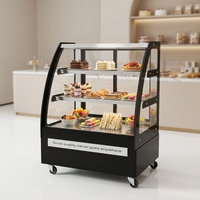 Vitrine réfrigérée pour gâteaux en verre incurvé, trois étagères, corps peint en noir, roulettes mobiles, rangement pour pâtisseries et desserts