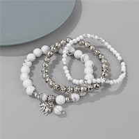 Lot de Bracelets Tendance en Pierres Naturelles Perles d'Améthyste et d'Howlite 4mm 6mm 8mm avec Breloque Éléphant Superposée pour Femmes et Hommes