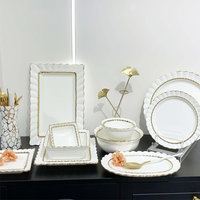 Service de table en céramique et porcelaine de luxe blanc avec bordure dorée, écologique et étanche, idéal pour les cadeaux de mariage, vente en gros