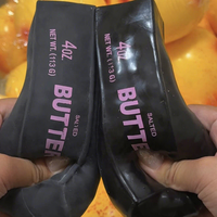Boule anti-stress noire en forme de bâton de beurre, faite à la main, croustillante et moelleuse, jouet de Noël artisanal