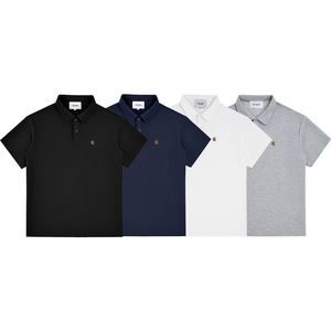 Camiseta de manga corta bordada con etiqueta dorada de marca de moda, estilo unisex para parejas, corte holgado tipo concha, top de color liso. - Product Image 1