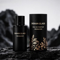 Flacon de parfum en verre de luxe noir exquis de 100 ml, forme cylindrique, personnalisable avec votre propre marque, avec couvercle noir magnétique, vente chaude