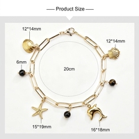 Bracelet de la série Ocean avec breloques étoile de mer, coquillage et dauphin, et perles rondes en cristal jaune améthyste pour femme