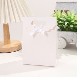 Solid White Cardboard Tote <b>Bag</b> with Bow Design Large Capacity and Customizable Logo Print for Promotional Paper <b>Gift</b> Packaging - Product Image 3