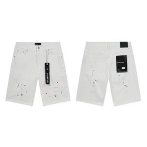 Pantalones cortos de mezclilla vintage con parches rotos, efecto salpicado de tinta y pedrería, estilo urbano de marca Purple, de corte cropped. - Product Image 2