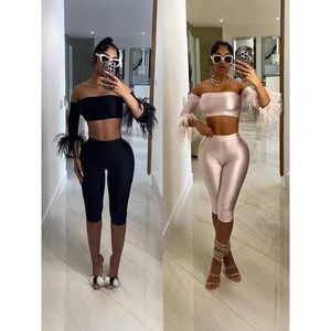 Voikerdr Conjunto de dos piezas para mujer, top con hombros descubiertos y mangas de plumas y pantalones cortos de satén, conjunto sexy para el verano - Product Image 2