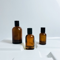 Vente en gros Bouteilles en verre de parfum de luxe à bronzage clair Offre Spéciale 30ml 50ml 100ml Emballage/diffuseur avec couvercle de pulvérisateur à pompe à plat avec logo personnalisé