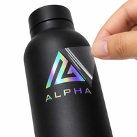Autocollant holographique UV ultra-fin personnalisé pour bouteille en plastique, sans bord surélevé, effet arc-en-ciel changeant de couleur, autocollant à frotter