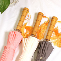 Parapluie de voyage manuel de haute qualité, haute densité, résistant à l'eau, avec manche en bambou 16K, protection UV, design pliable en trois parties